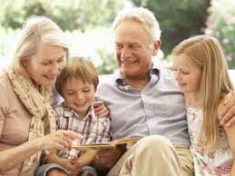 grandparents reading with grandchildren